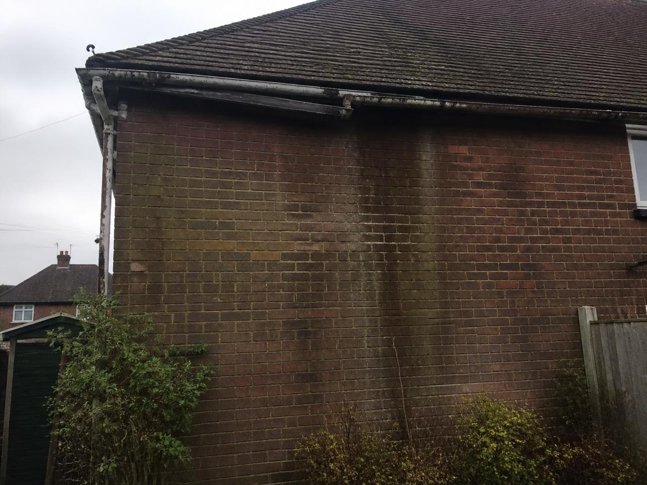 Before: rusted metal guttering leaking at the joints on a Richmond property